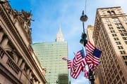 US flags on lamp-post outside Grand Central Station, New York City NY015