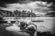 Boulders and jetty on Derwent Water, near Keswick, Cumbria, England. EM006