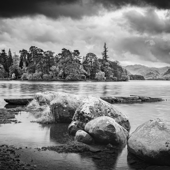 Boulders and jetty on Derwent Water, near Keswick, Cumbria, England. EM006