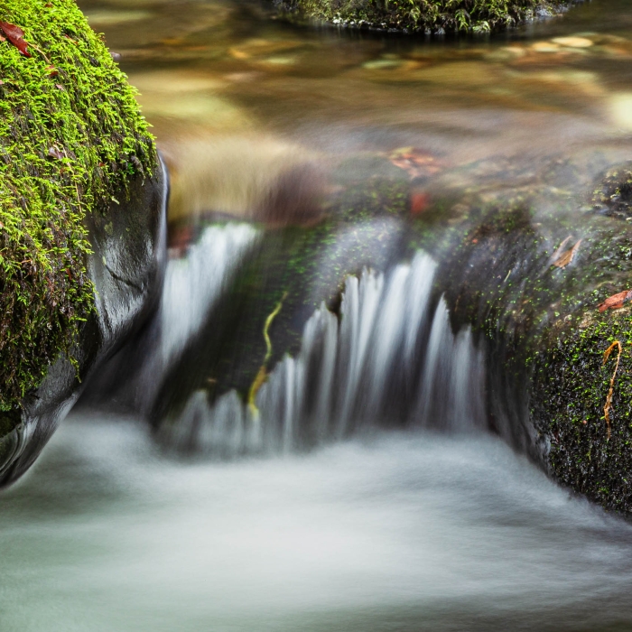 Water passing over rocks on Stock Ghyll beck, near Ambleside, Cumbria, England. EL022