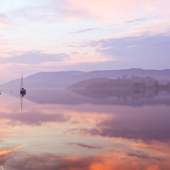 Dawn reflections on Windermere, from Waterhead pier, Cumbria, England. EL028