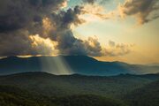 Sunlight passing through clouds at Three Knob Overlook on the Blue Ridge Parkway, North Carolina, USA NC003