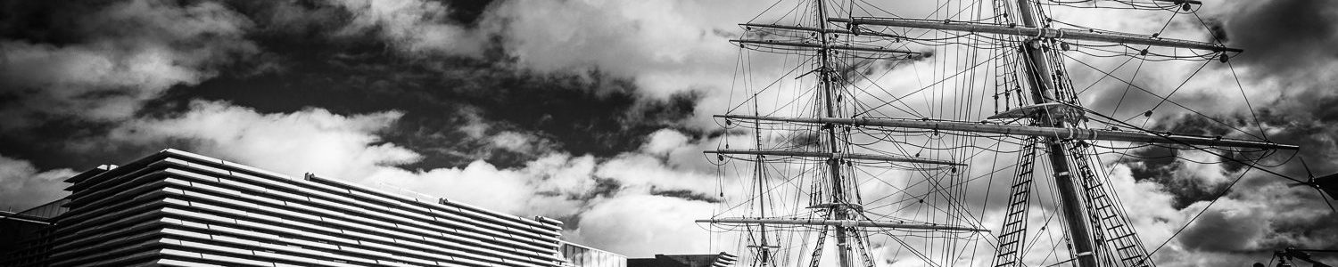 Monochrome (black and white) image of RRS Discovery and the V&A Dundee, Dundee, Scotland. DD023