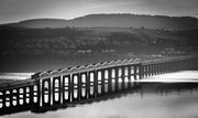 Monochrome image of the Tay Rail Bridge from Dundee, Scotland. DD038