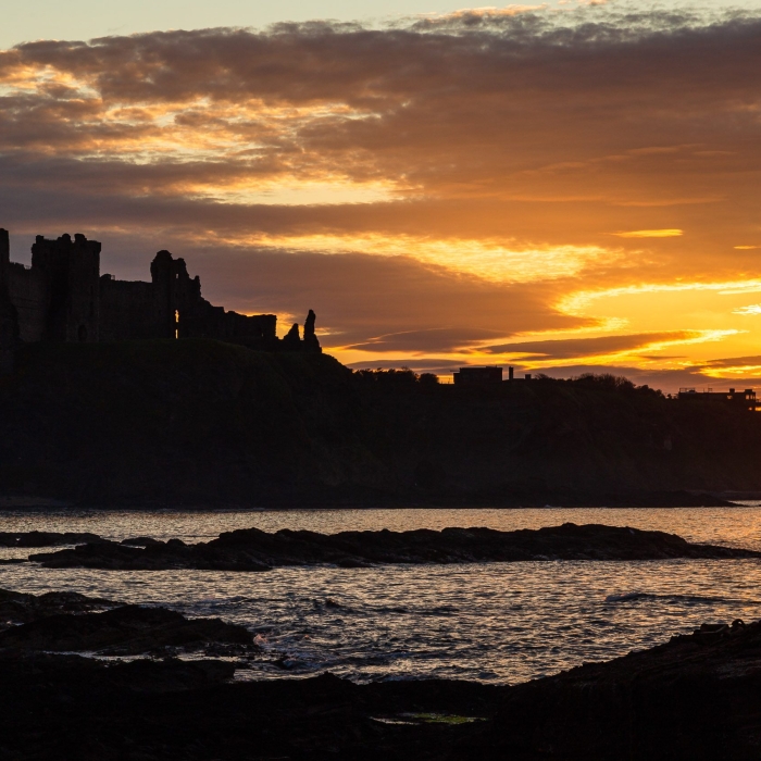 Tantallon Castle silhouetted against the sunset from Seacliff, East Lothian, Scotland. LN003