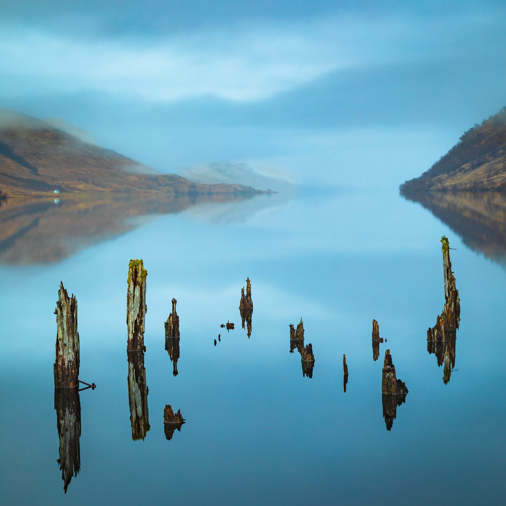 Rotting old pier supports at the head of Loch Arkaig, Lochaber, Scotland.