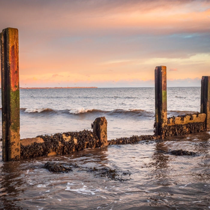 The remains of a concrete groyne on Broughty Ferry beach, Dundee, Scotland.