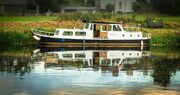 Moored river-boat on the River Barrow at Graiguenamanagh, County Kilkenny, Ireland. BR022