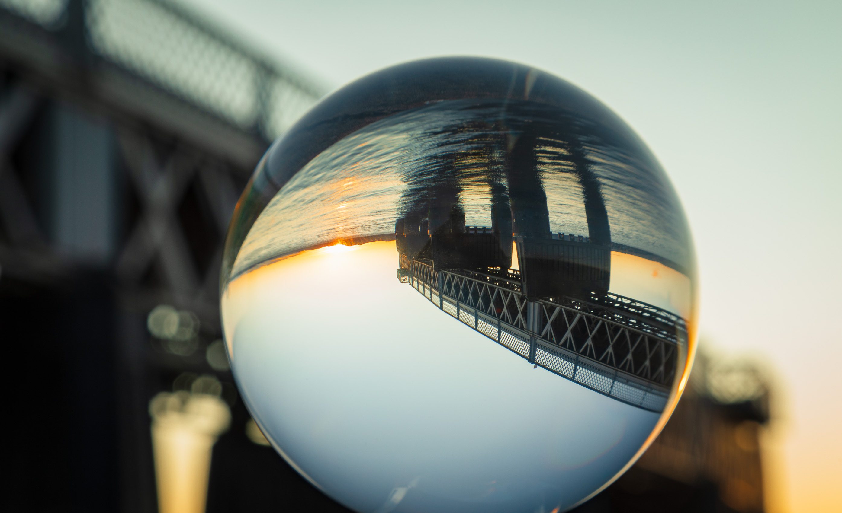 Tay Railway Bridge reflected in glass sphere, Dundee, Scotland.